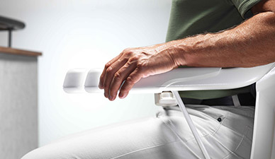 Adjustable armrests on stairlift Stannah-Solus